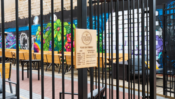 Beautification Loan Helps Open the Gates For Seasonal Outdoor Patio, The Yard